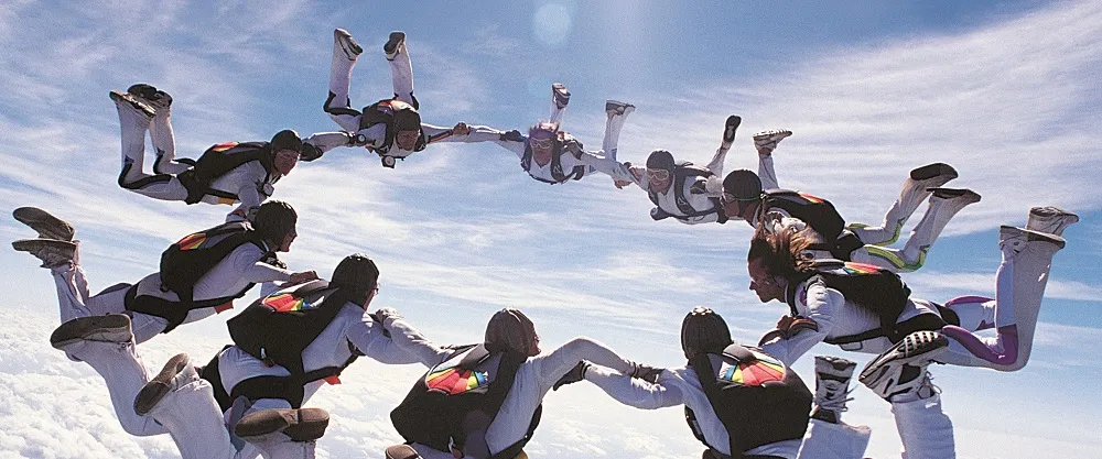 Parachute teams diving